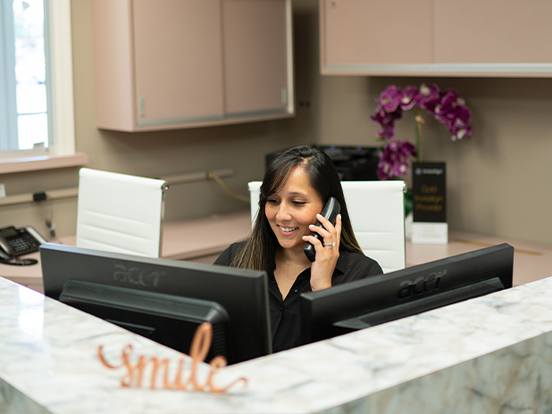 Dental team member talking on the phone