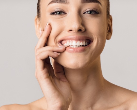 Woman sharing healthy smile after antibiotic therapy