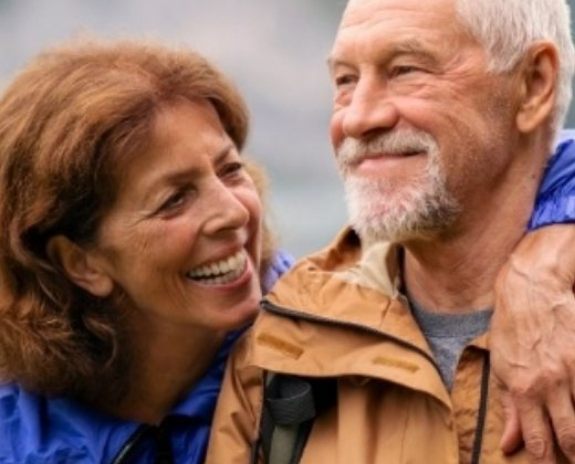 Man and woman enjoying the benefits of dental implants