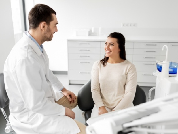 Woman discussing options for T M J therapy with her dentist